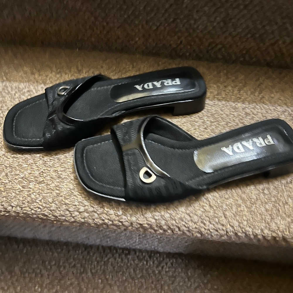 Prada Black Women's Mules with Gold Accent